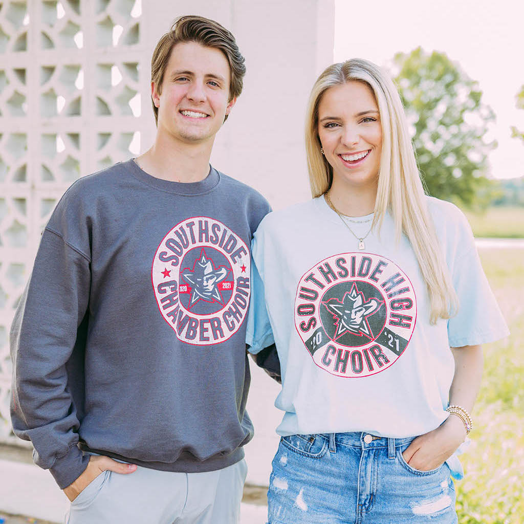 Boy and girl stand together. Boy wears a dark gray Southside Chamber Choir sweatshirt. Girl wears white Southside Chamber Choir Tshirt.